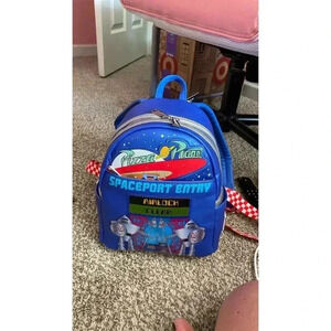 Loungefly Pixar Toy Story Pizza Planet Mini Backpack Blue Glow-in-the-Dark
